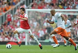 Arsenal v Blackpool 2010-11 Gallery: Cesc Fabregas (Arsenal) Alex Baptiste (Blackpool). Arsenal 6: 0 Blackpool