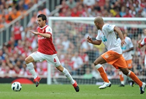 Images Dated 21st August 2010: Cesc Fabregas (Arsenal) Alex Baptiste (Blackpool). Arsenal 6: 0 Blackpool