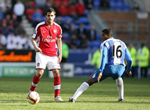Images Dated 11th April 2009: Cesc Fabregas (Arsenal) Antonio Valencia (Wigan)
