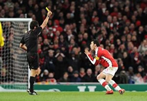 Images Dated 31st March 2010: Cesc Fabregas (Arsenal) is booked by referee Massimo Busacca. Arsenal 2: 2 Barcelona