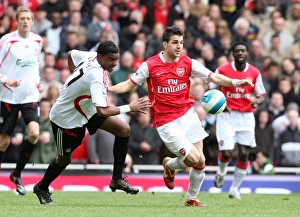 Arsenal v Liverpool 2007-08 Collection: Cesc Fabregas (Arsenal) Damien Plessis (Liverpool)