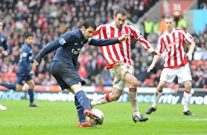 Stoke City v Arsenal - FA Cup 2009-10 Gallery: Cesc Fabregas (Arsenal) Danny Higginbotham (Stoke). Stoke City 3: 1 Arsenal