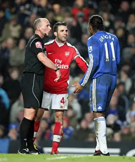 Cesc Fabregas (Arsenal) Didier Drogba (Chelsea) and Referee Mike Dean. Chelsea 2