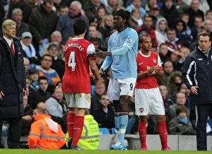 Manchester City v Arsenal 2010-11 Collection: Cesc Fabregas (Arsenal) Emmanuel Adebayor (Man City). Manchester City 0: 3 Arsenal