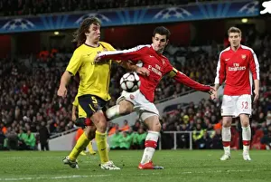 Cesc Fabregas (Arsenal) is fouled by Carles Puyol (Barcelona) resulting in a penalty for Arsenal