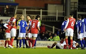 Images Dated 1st January 2011: Cesc Fabregas (Arsenal) inured by a tackle by Birmingham defender Roger Johnson