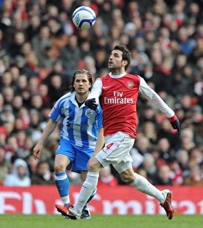 Images Dated 30th January 2011: Cesc Fabregas (Arsenal) Joey Gudjonsson (Huddersfield). Arsenal 2: 1 Huddersfield Town