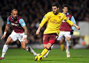 West Ham United v Arsenal 2010-11 Collection: Cesc Fabregas (Arsenal) Julien Faubert (West Ham). West Ham United 0: 3 Arsenal