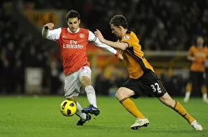 Images Dated 10th November 2010: Cesc Fabregas (Arsenal) Kevin Foley (Wolves). Wolverhampton Wanderers 0: 2 Arsenal