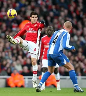Images Dated 6th December 2008: Cesc Fabregas (Arsenal) Lee Cattermole (Wigan)