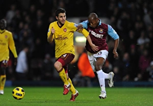 West Ham United v Arsenal 2010-11 Collection: Cesc Fabregas (Arsenal) Luis Boa Morte (West Ham). West Ham United 0: 3 Arsenal