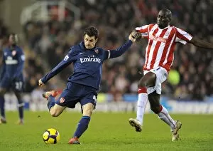 Images Dated 27th February 2010: Cesc Fabregas (Arsenal) Mamady Sidibe (Stoke). Stoke City 1: 3 Arsenal, Barclays Premier League