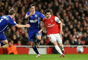 Images Dated 25th January 2011: Cesc Fabregas (Arsenal) Mark Kennedy (Ipswich). Arsenal 3: 0 Ipswich Town