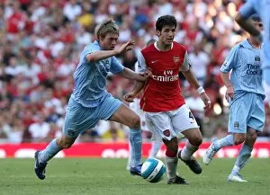 Images Dated 25th August 2007: Cesc Fabregas (Arsenal) Michael Johnson (Man City)