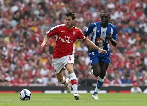 Arsenal v Wigan Athletic 2009-10 Collection: Cesc Fabregas (Arsenal) Mohamed Diame (Wigan)