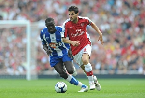 Arsenal v Wigan Athletic 2009-10 Collection: Cesc Fabregas (Arsenal) Mohammed Diame (Wigan)