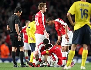 Cesc Fabregas (Arsenal) sits on the floor injured having just scored Arsenals 2nd goal