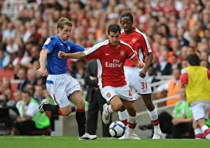 Arsenal v Rangers 2009-10 Collection: Cesc Fabregas (Arsenal) Steven Davis (Rangers)