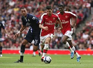 Images Dated 4th October 2009: Cesc Fabregas (Arsenal) Steven Nzonzi (Blackburn)