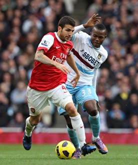 Images Dated 30th October 2010: Cesc Fabregas (Arsenal) Victor Obinna (West Ham). Arsenal 1: 0 West Ham United