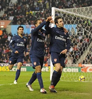 Stoke City v Arsenal 2009-10 Collection: Cesc Fabregas celebrates scoring the 2nd Arsenal goal with Theo Walcott and Eduardo