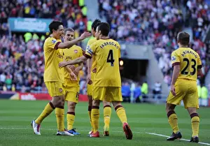 Cesc Fabregas celebrates scoring the Arsenal goal with Samir Nasri, Marouane Chamakh