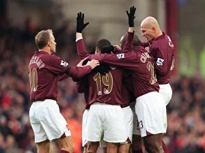 Images Dated 28th November 2005: Cesc Fabregas celebrates scoring Arsenals 1st goal with his team mates