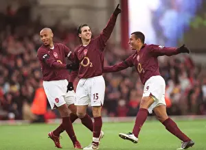 Cesc Fabregas celebrates scoring Arsenals 1st goal with Thierry Henry and Gilberto
