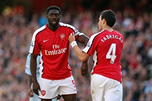 Cesc Fabregas hands over the captains arm band to Kolo Toure Cesc Fabregas hands over the captains arm band to Kolo Toure