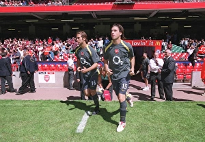 Cesc Fabregas and Mathieu Flamini (Arsenal) run out to warm up Cesc Fabregas and Mathieu Flamini (Arsenal) run out to warm up