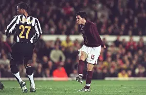 Cesc Fabregas scores Arsenals 1st goal under pressure from Jonathan Zebina (Juve)
