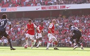 Images Dated 16th April 2007: Cesc Fabregas scores Arsenals 2nd goal past Abdoulay Meite (Bolton)