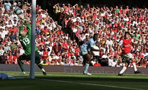 Arsenal v Manchester City 2007-08 Collection: Cesc Fabregas scores Arsenals goal past Micah Richards and Casper Schmeichel