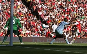 Images Dated 25th August 2007: Cesc Fabregas scores Arsenals goal past Micah Richards and Casper Schmeichel