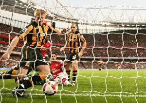Arsenal v Hull City 2008-9 Collection: Cesc Fabregas scores Arsenals goal under pressure from Paul McShane