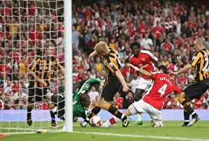Arsenal V Hull City 2008-9 Prints: Cesc Fabregas scores Arsenals goal under pressure from Paul McShane