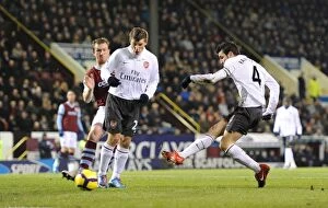 Burnley v Arsenal 2009-10 Collection: Cesc Fabregas shoots past Burnley goalkeeper Brian Jensen to score the Arsenal goal