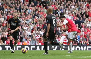 Cesc Fabregas shoots past Edwin van der Sar to score the 1st Arsenal goal