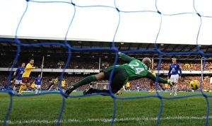 Cesc Fabregas shoots past Everton goalkeeper Tim Howard to score the 2nd Arsenal goal Cesc Fabregas shoots past Everton goalkeeper Tim Howard to score the 2nd Arsenal goal