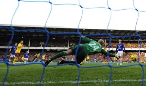 Everton V Arsenal 2010-11 Prints: Cesc Fabregas shoots past Everton goalkeeper Tim Howard to score the 2nd Arsenal goal