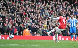 Cesc Fabregas shoots past Huddersfield goalkeeper Ian Bennett from the penalty spot to score the 2nd Arsenal goal
