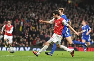 Cesc Fabregas shoots past Ipswich goalkeeper Marton Fulop to score the 3rd Arsenal goal