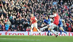 Images Dated 8th January 2011: Cesc Fabregas shoots past Leeds goalkeeper Kasper Schmeichel to score the Arsenal goal