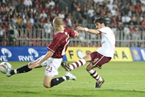 Sparta Prague v Arsenal 2007-8 Gallery: Cesc Fabregas shoots past Sparta goalkeeper Tomas Postulka to score the 1st Arsenal goal