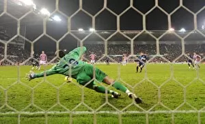 Cesc Fabregas shoots past Stoke goalkeeper Thomas Sorensen from the penalty spot to score the 2nd Arsenal goal