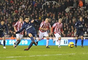 Stoke City v Arsenal 2009-10 Collection: Cesc Fabregas shoots past Stoke goalkeeper Thomas Sorensen to score the 2nd Arsenal goal