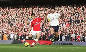 Images Dated 31st October 2009: Cesc Fabregas shoots past Tottenham goalkeeper Heurelho
