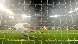 Arsenal v West Ham United 2009-10 Collection: Cesc Fabregas shoots past West Ham goalkeeper Robert Green to score the 2nd Arsenal goal from