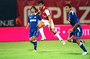 Images Dated 10th August 2006: Cesc Fabregas shoots past Zagreb goalkeeper Ivan Turina to score the 3rd Arsenal goal