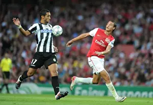 Arsenal V Udinese 2011-12 Prints: Chamakh vs Benatia: A Clash of Strengths in Arsenal's UEFA Champions League Showdown with Udinese